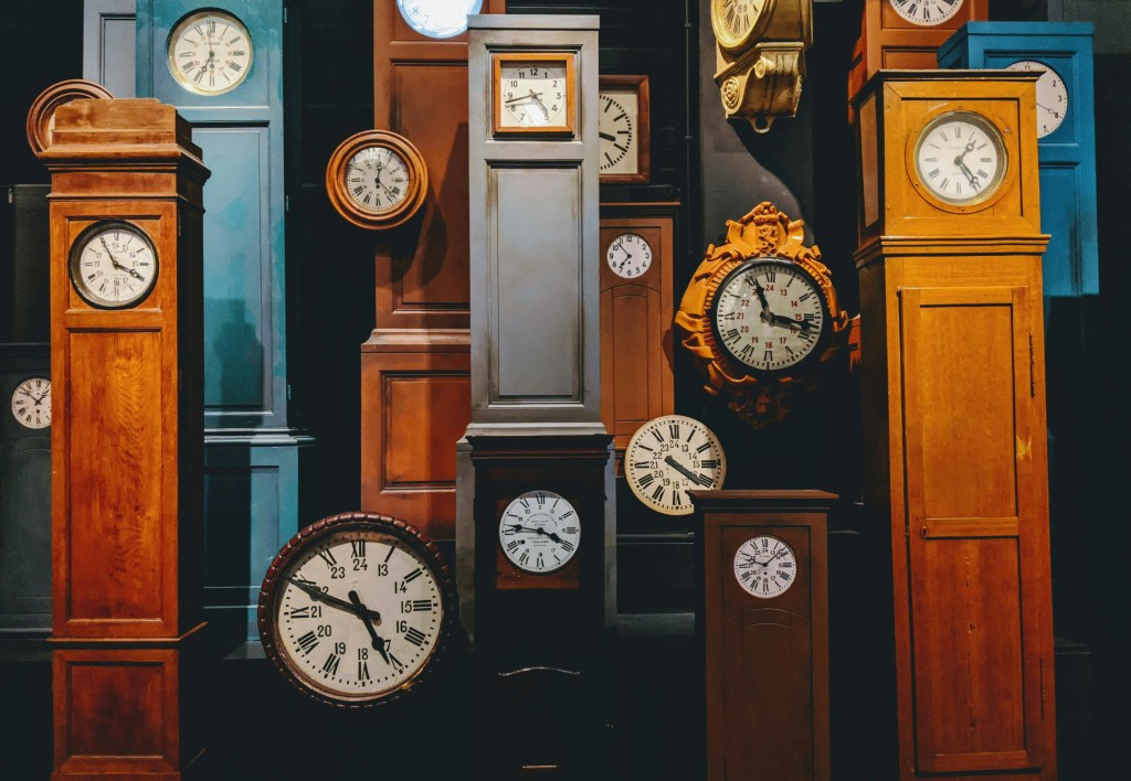 a collage of old clocks